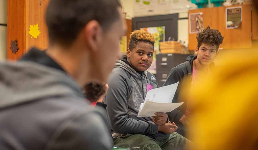 students in middle school engaging